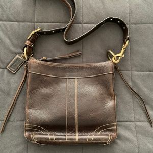 Brown leather Coach crossbody bag.